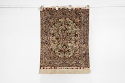 Lot 380 - A Persian silk rug