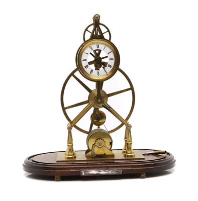 Lot 225 - A brass skeleton clock