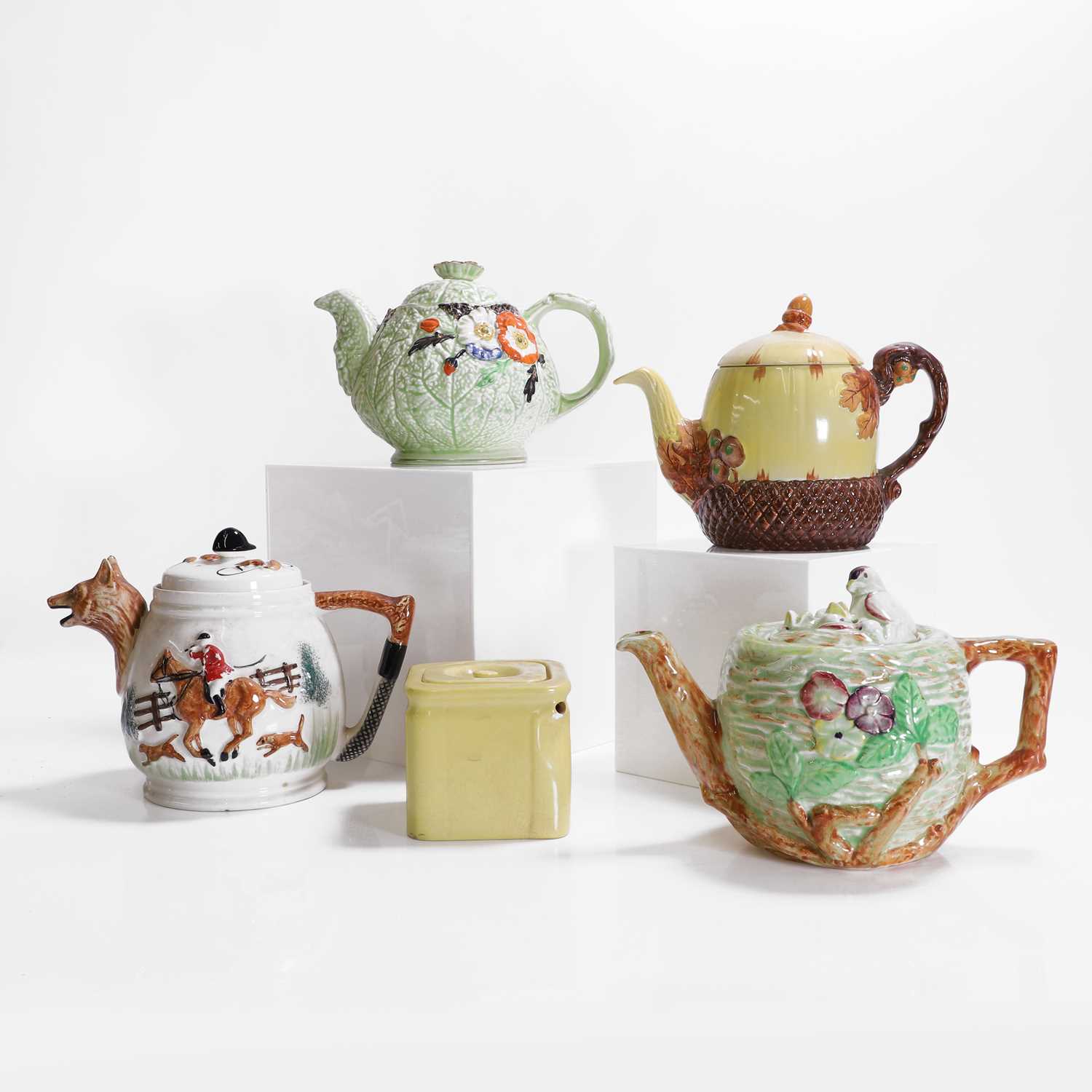 Lot 183 - Five pottery teapots and covers