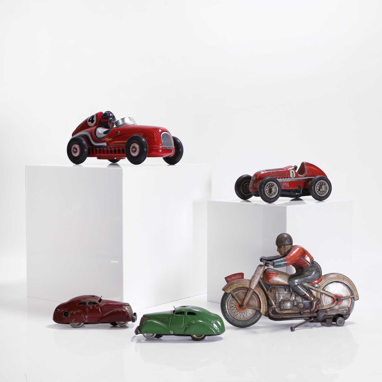 Lot 421 - A collection of five tinplate model vehicles