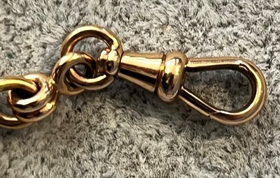 Lot 100 - An 18ct gold half hunter pocket watch with albert chain