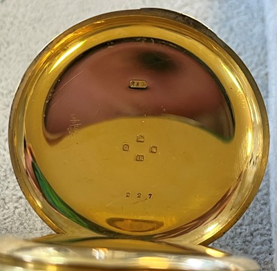 Lot 100 - An 18ct gold half hunter pocket watch with albert chain