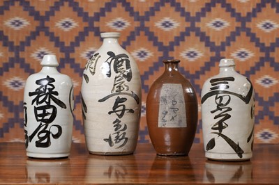 Lot 116 - Four stoneware saké bottles