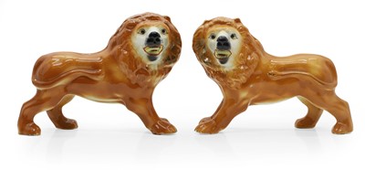 Lot 111 - A pair of Staffordshire pottery lions