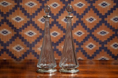 Lot A pair of silver mounted cut glass decanters