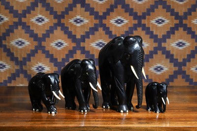 Lot A group of four Indian ebony elephant figures