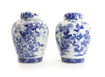 Lot 136 - A pair of Japanese blue and white jars and covers