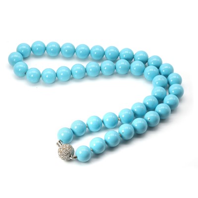 Lot 239 - A diamond set ball clasp