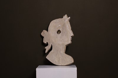 Lot 638 - A painted plaster profile portrait