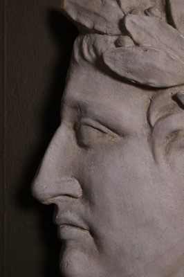 Lot 638 - A painted plaster profile portrait