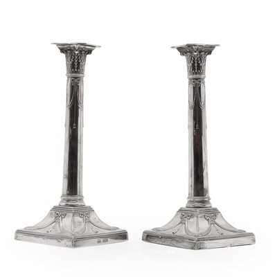 Lot 4 - A pair of silver candlesticks