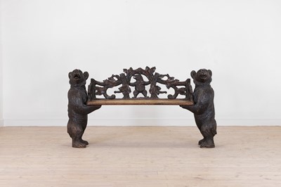 Lot A Black Forest carved wooden bench