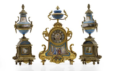 Lot 202 - A French gilt metal and porcelain three piece clock garniture