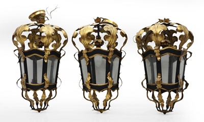 Lot 399 - A set of three Regency design ebonised and gilt metal lanterns