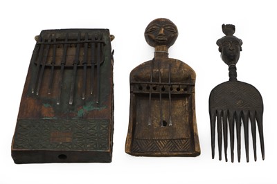 Lot 276 - A group of three Ashanti combs