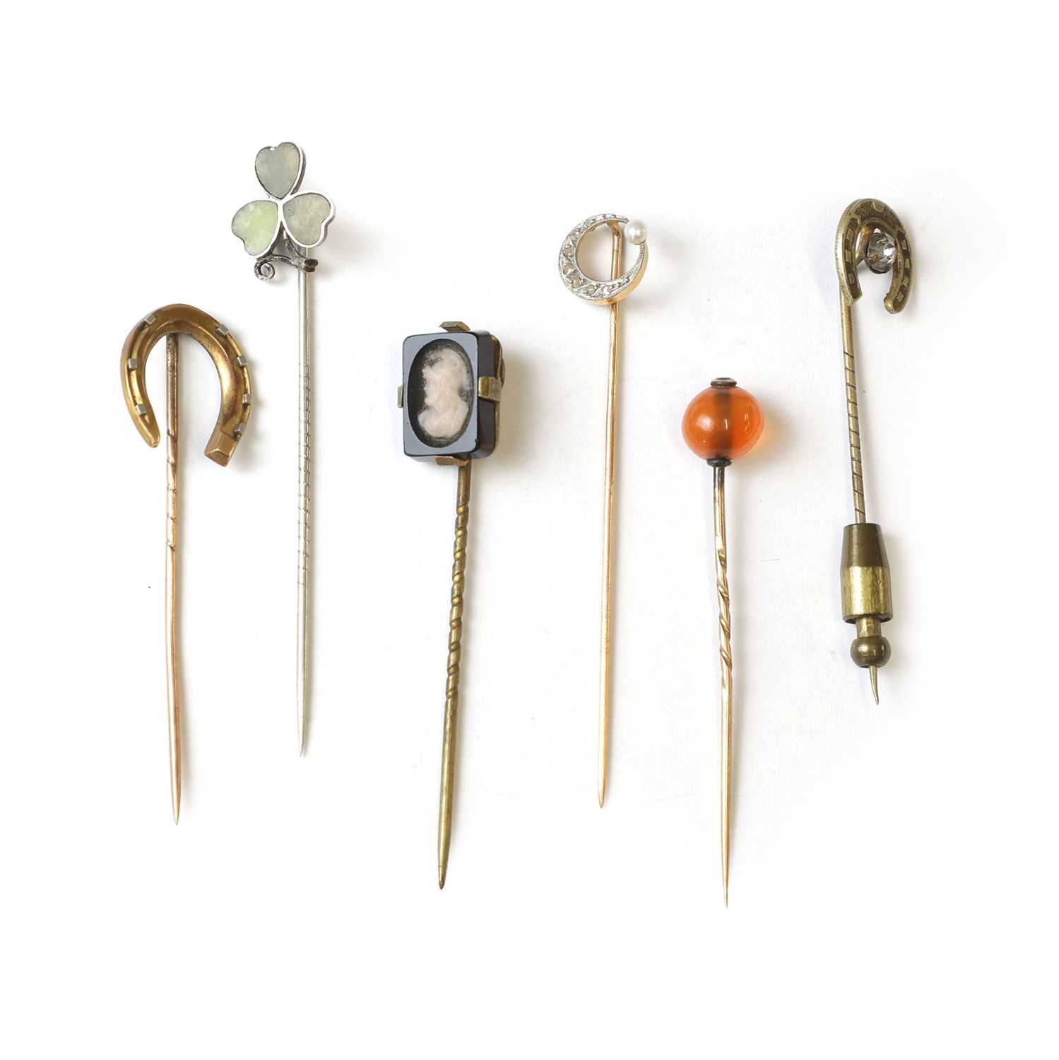 Lot 307 - A group of six stick pins,