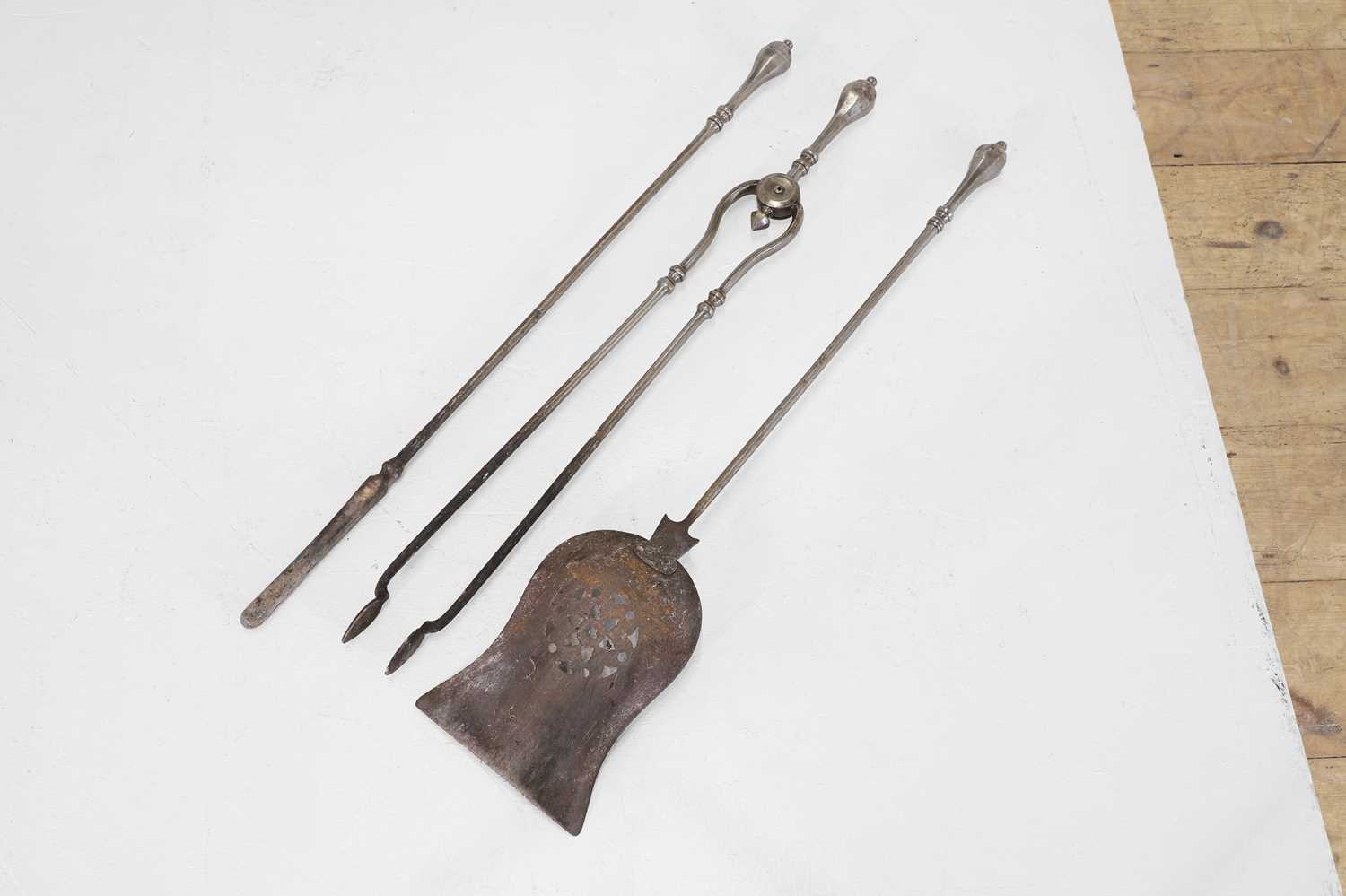 Lot 50 - A set of George III steel fire tools,
