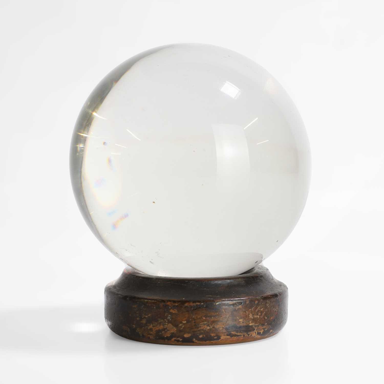 Lot 29 - A crystal ball on a period wood stand