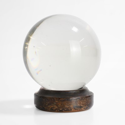 Lot 29 - A crystal ball on a period wood stand
