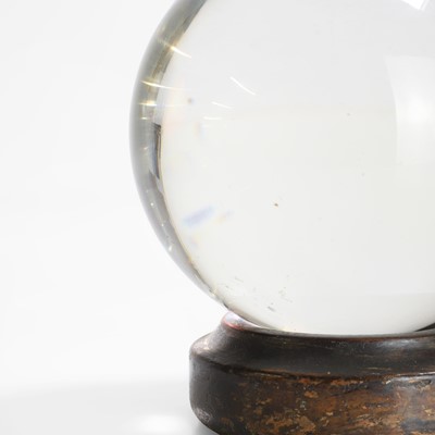 Lot 29 - A crystal ball on a period wood stand