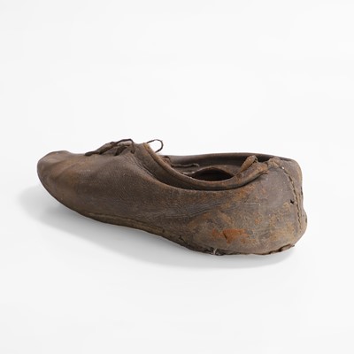 Lot 13 - A petrified child's chimney shoe