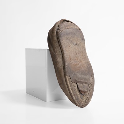 Lot 13 - A petrified child's chimney shoe