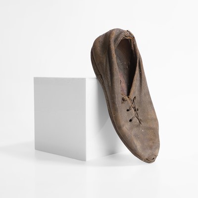 Lot 13 - A petrified child's chimney shoe