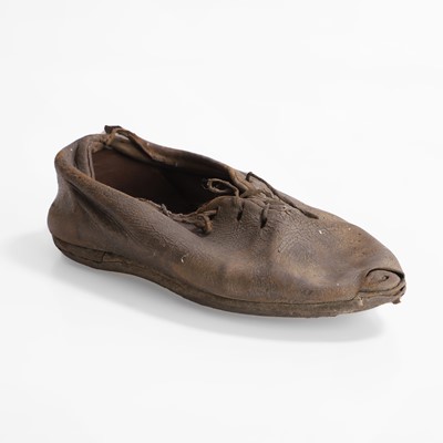 Lot 13 - A petrified child's chimney shoe