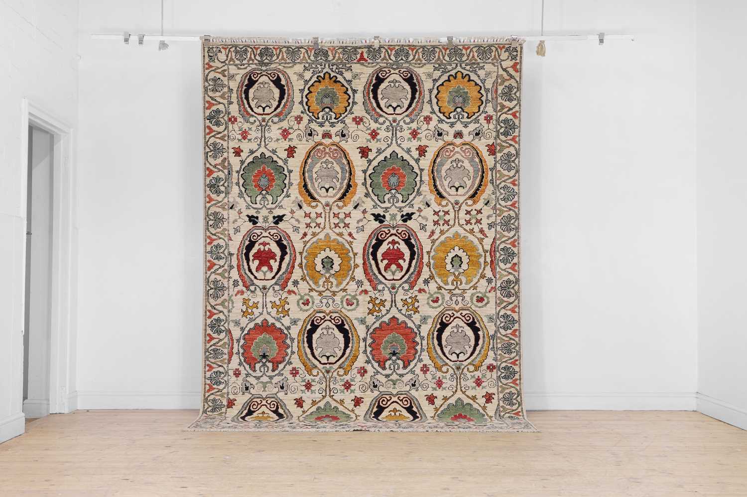 Lot 664 - A Suzani-inspired wool carpet