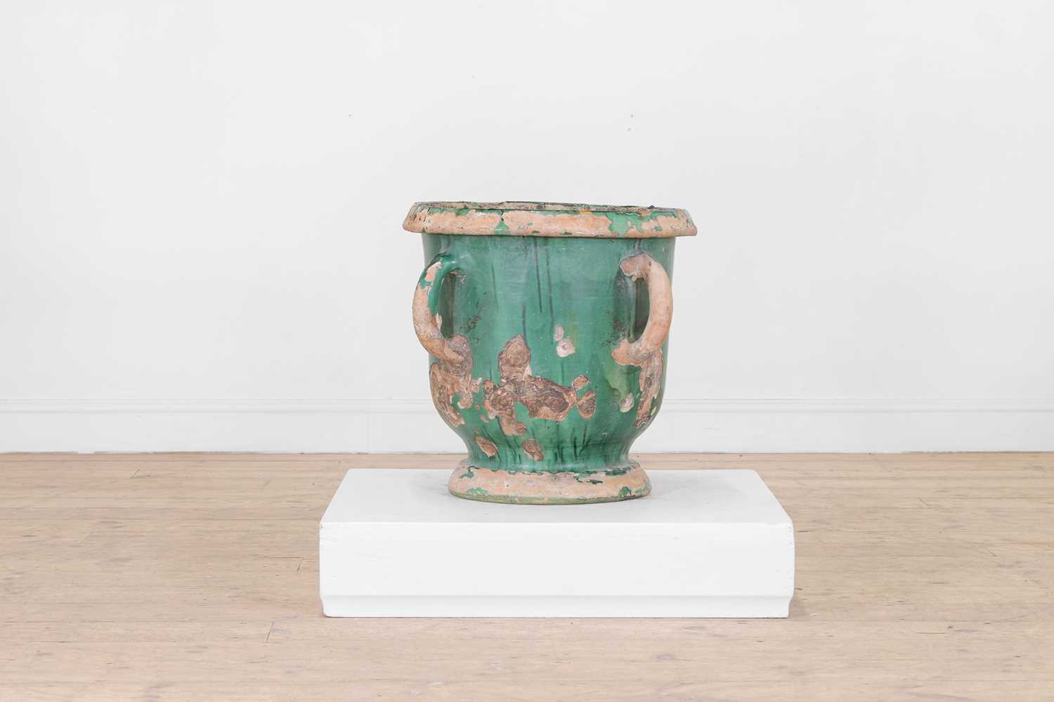 Lot 615 - A glazed terracotta urn