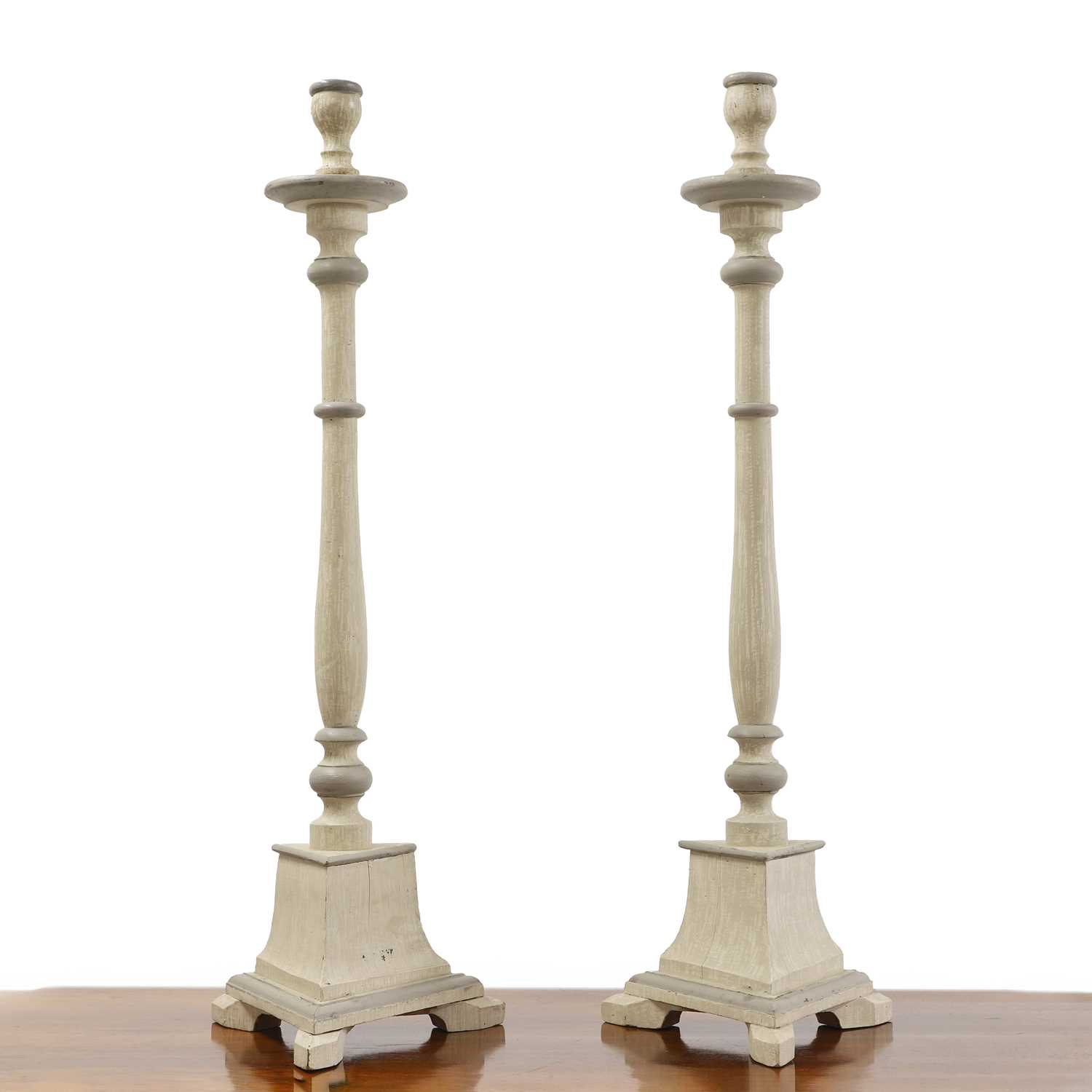 Lot 681 - A pair of Swedish Baroque-style painted wooden candlestick holders