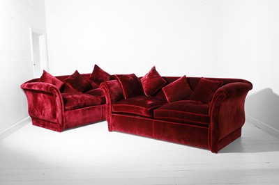 Lot 491 - A pair of red velvet two-seater sofas