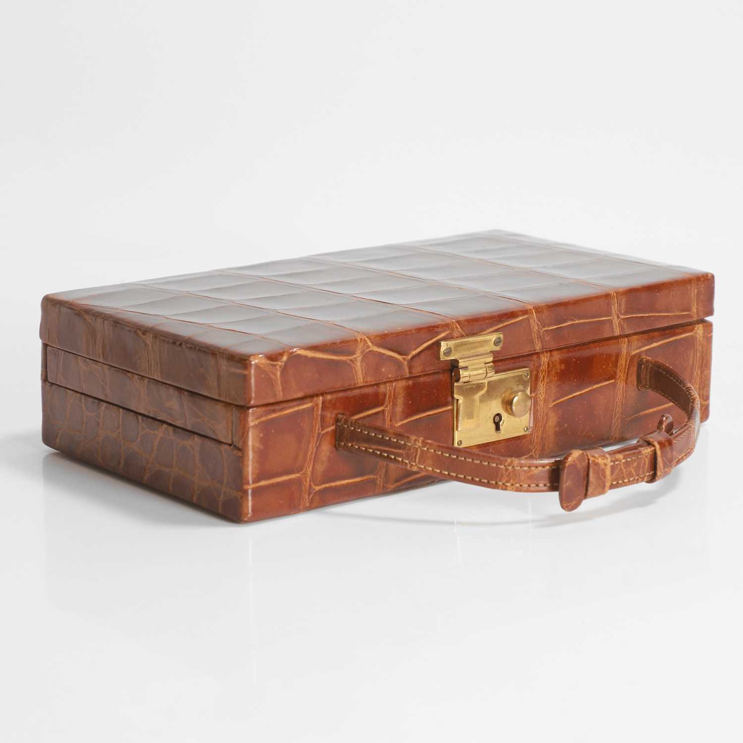Lot 450 - An Asprey crocodile travelling jewellery case