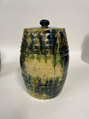Lot 516 - A set of three glazed earthenware storage jars and covers