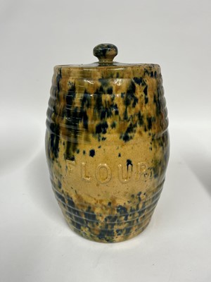Lot 516 - A set of three glazed earthenware storage jars and covers