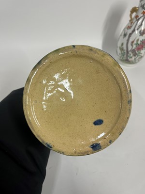 Lot 516 - A set of three glazed earthenware storage jars and covers