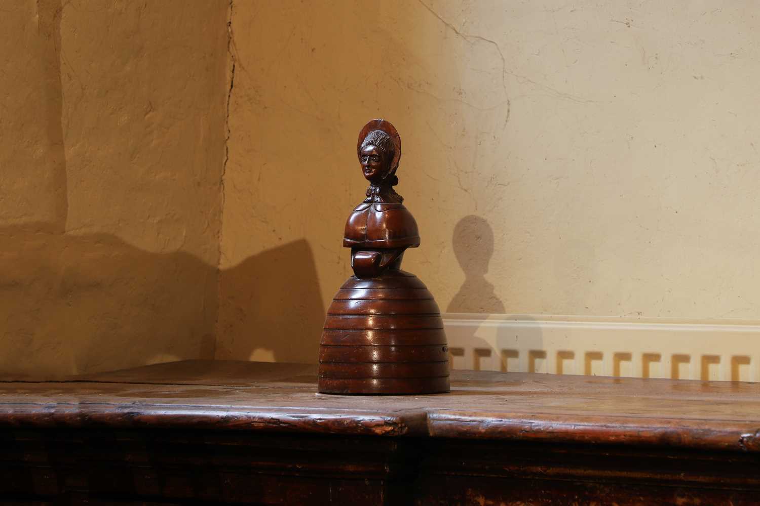 Lot 536 - A treen caricature walnut money bank