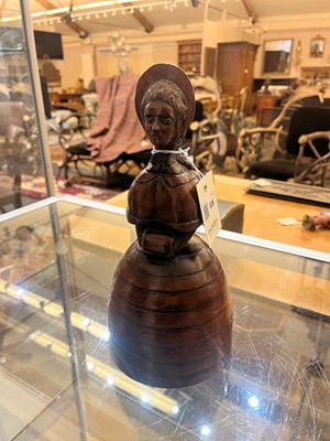 Lot 536 - A treen caricature walnut money bank