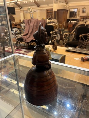 Lot 536 - A treen caricature walnut money bank