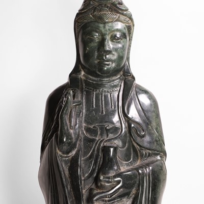 Lot 125 - A large Chinese spinach jade carving