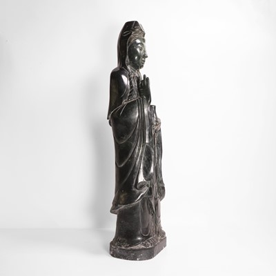 Lot 125 - A large Chinese spinach jade carving