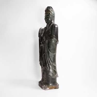 Lot 125 - A large Chinese spinach jade carving