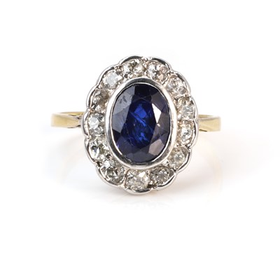 Lot 67 - A synthetic sapphire and diamond cluster ring