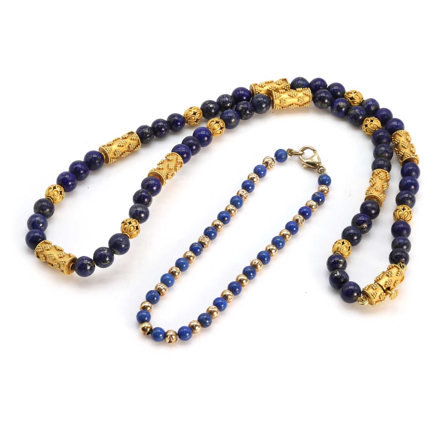 Lot 198 - A lapis lazuli bead necklace and a lapis lazuli bracelet