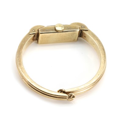 Lot 420 - A 9ct gold ladies' mechanical bangle watch