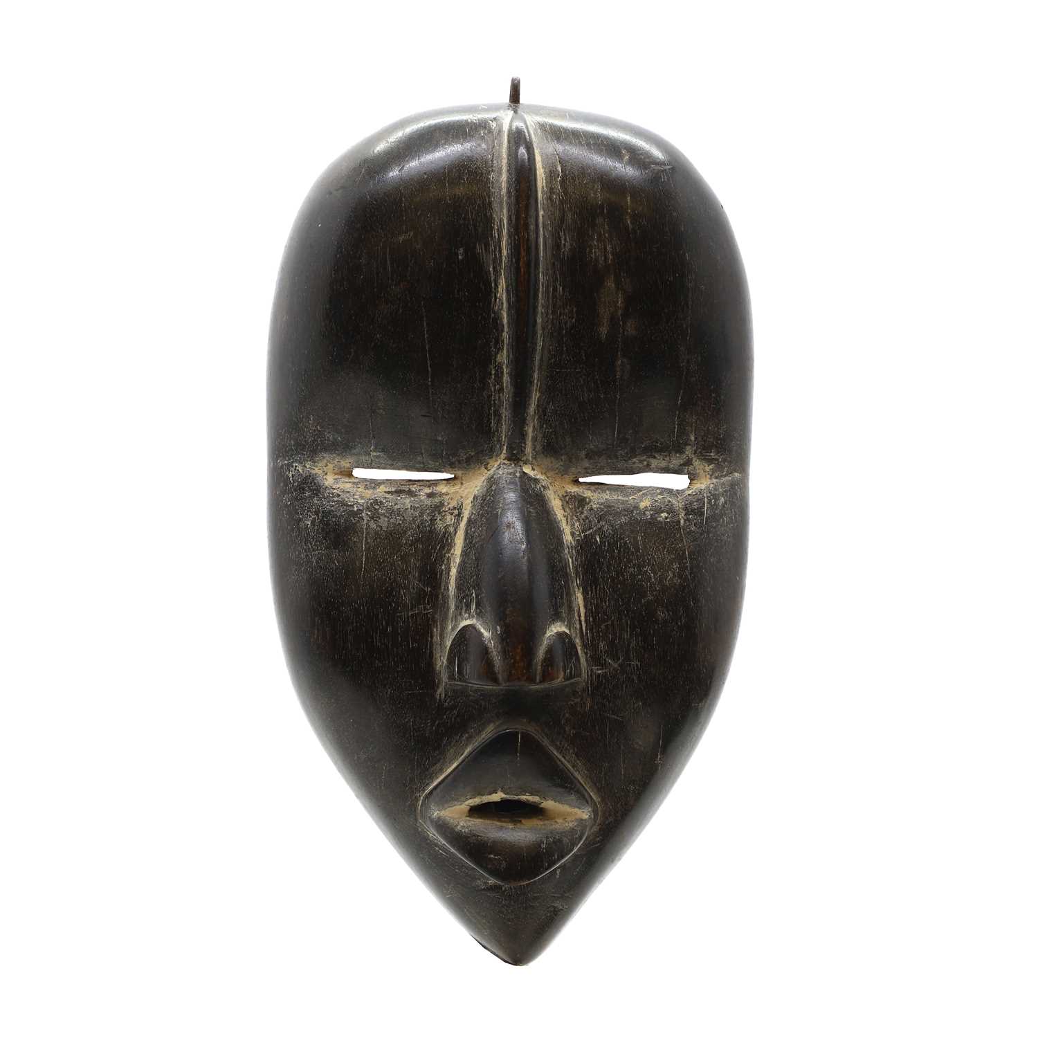 Lot 468 - A carved hardwood Dan mask