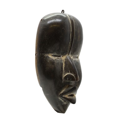 Lot 468 - A carved hardwood Dan mask