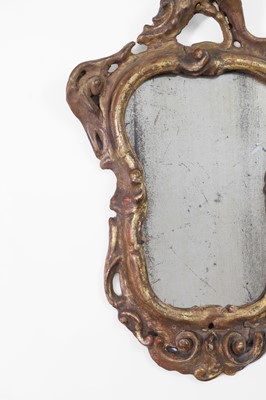 Lot 36 - A pair of small rococo giltwood mirrors