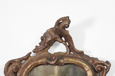 Lot 36 - A pair of small rococo giltwood mirrors