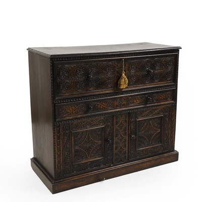 Lot 513 - A carved oak cupboard